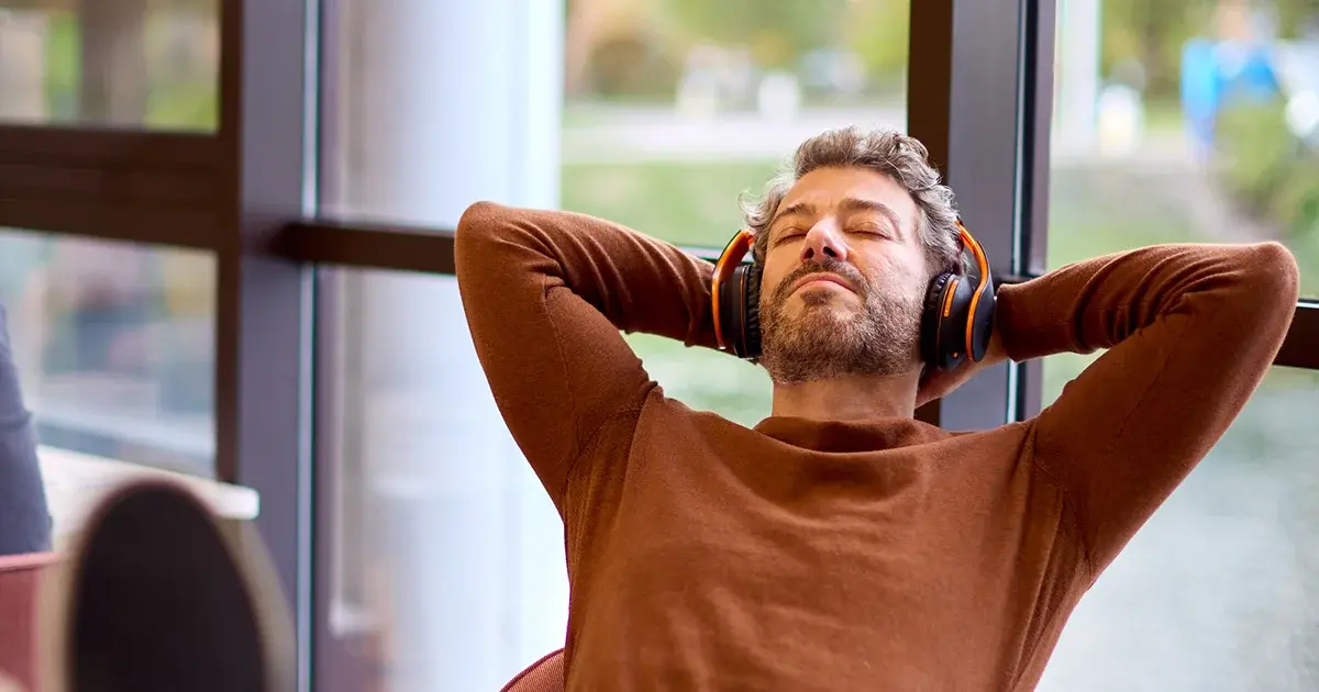 https://25531252.fs1.hubspotusercontent-eu1.net/hubfs/25531252/Imported_Blog_Media/man_relaxing_with_headphones_on-1.webp